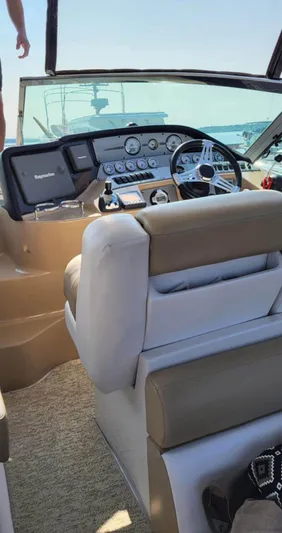  Yacht Photos Pics 2009 Four Winns 378 Vista boat cockpit with steering wheel and control panel.