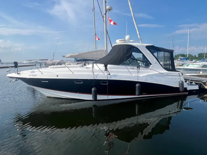  Yacht Photos Pics 2009 Four Winns 378 Vista yacht docked in calm marina waters.