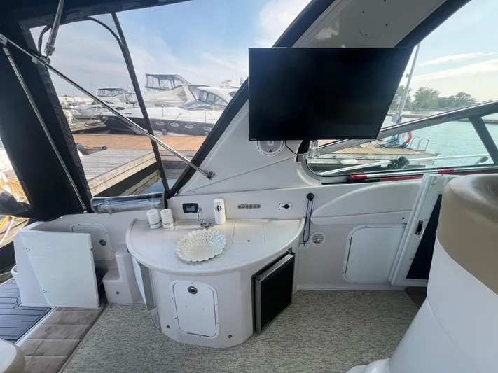  Yacht Photos Pics Interior of 2009 Four Winns 378 Vista yacht with TV and kitchenette.