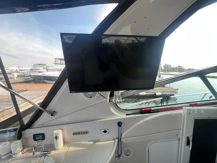  Yacht Photos Pics Interior of 2009 Four Winns 378 Vista yacht with mounted TV and marina view.