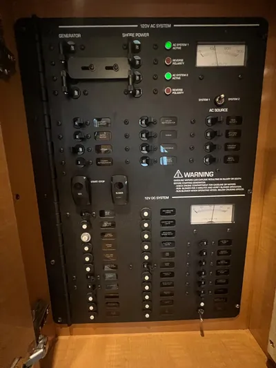  Yacht Photos Pics Electrical panel of a 2009 Four Winns 378 Vista boat, featuring 120V AC and 12V DC systems.