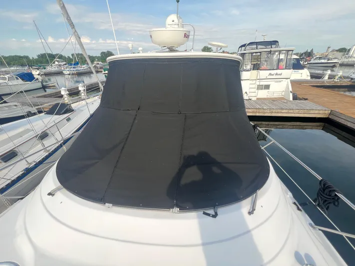  Yacht Photos Pics 2009 Four Winns 378 Vista yacht with black cover docked at marina.