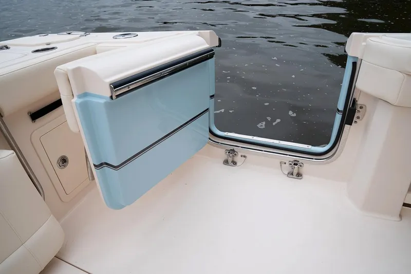  Yacht Photos Pics Manufacturer Provided Image: 2020 Grady-White Canyon 336 boat with open transom door by the water.