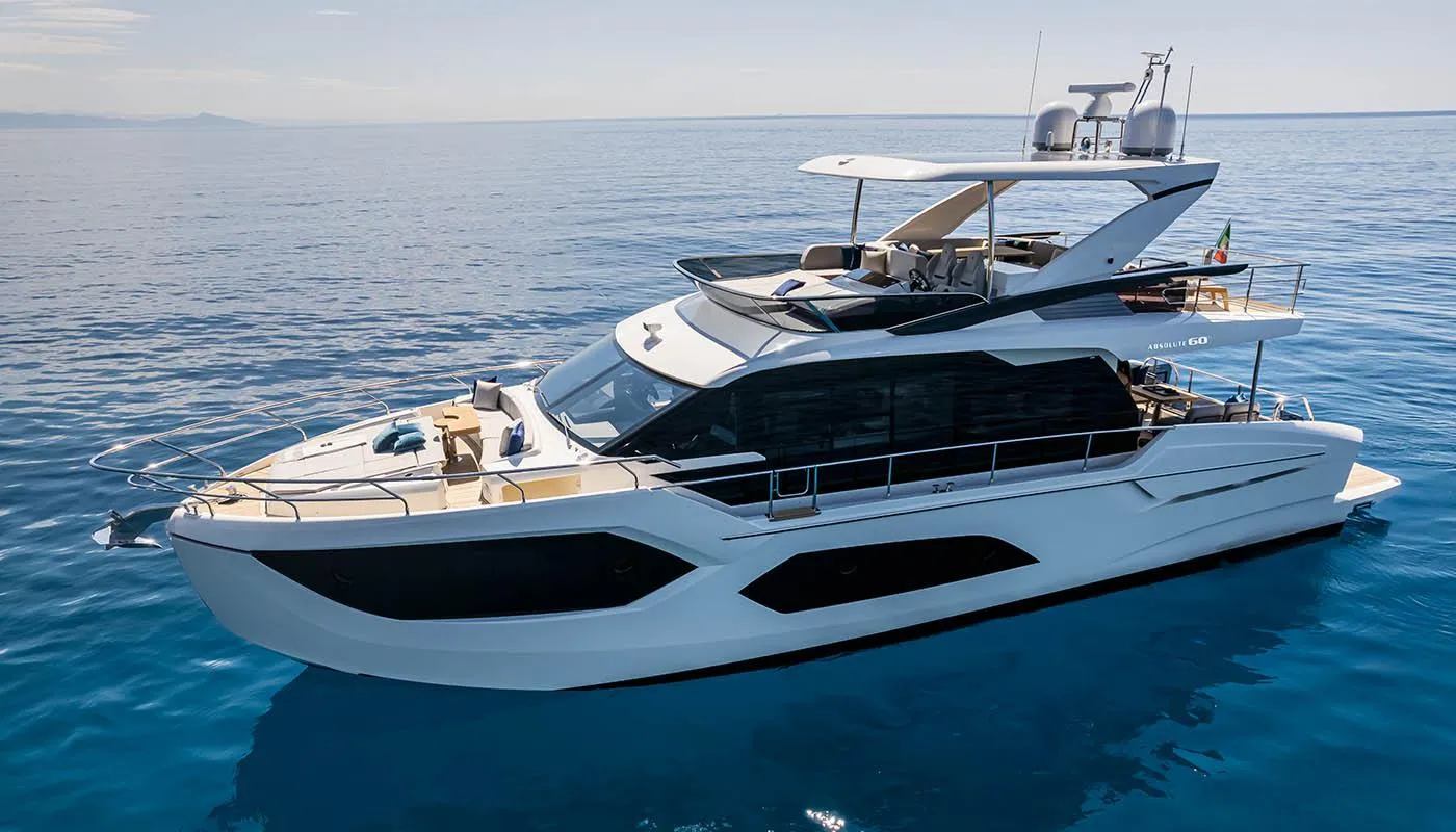2024 Absolute 60 Fly luxury yacht cruising on calm blue waters.