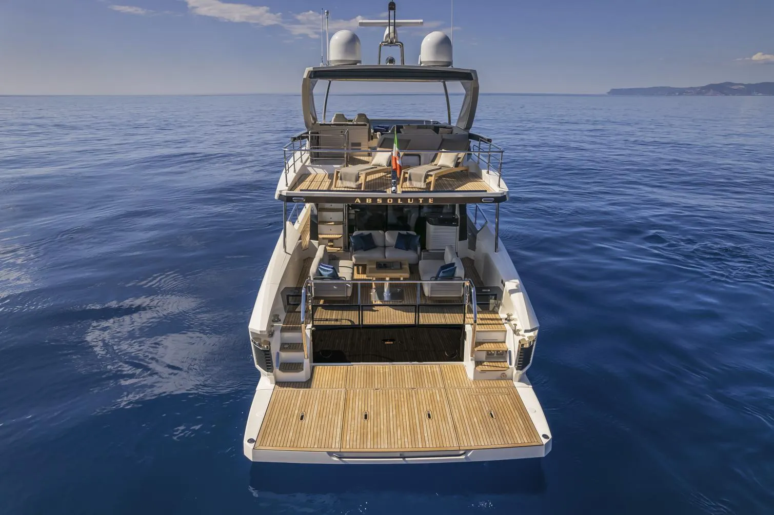 2024 Absolute 60 Fly luxury yacht on calm blue ocean.