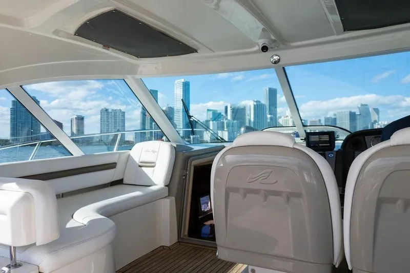 Yacht Photos Pics Interior of 2005 Sea Ray 48 Sundancer yacht with city skyline view.