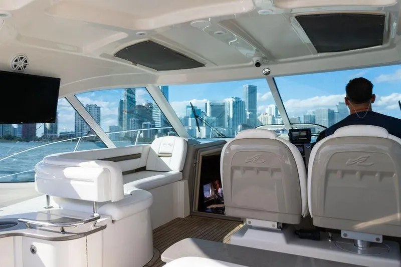  Yacht Photos Pics Interior of 2005 Sea Ray 48 Sundancer yacht with city skyline view.