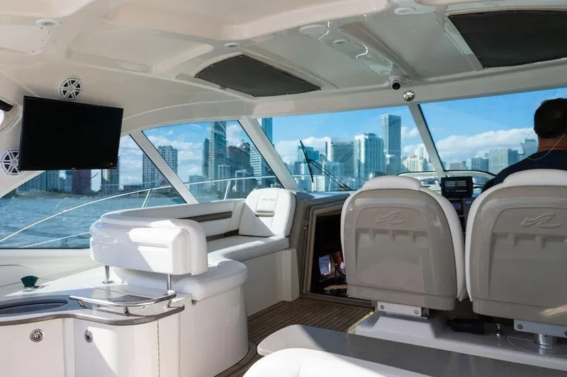  Yacht Photos Pics Interior of 2005 Sea Ray 48 Sundancer yacht with city skyline view.