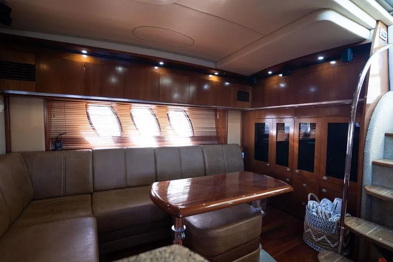  Yacht Photos Pics Luxurious 2005 Sea Ray 48 Sundancer yacht interior with elegant wood finishes and plush seating.