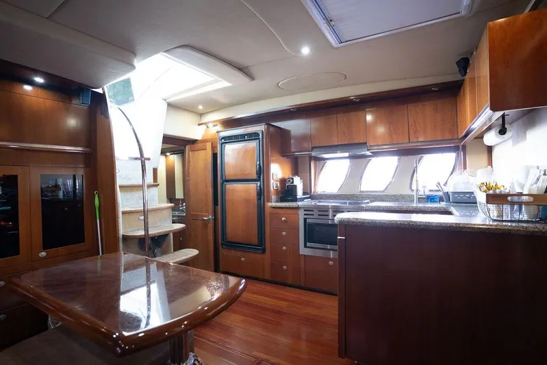  Yacht Photos Pics Luxurious interior of 2005 Sea Ray 48 Sundancer yacht with modern kitchen amenities.