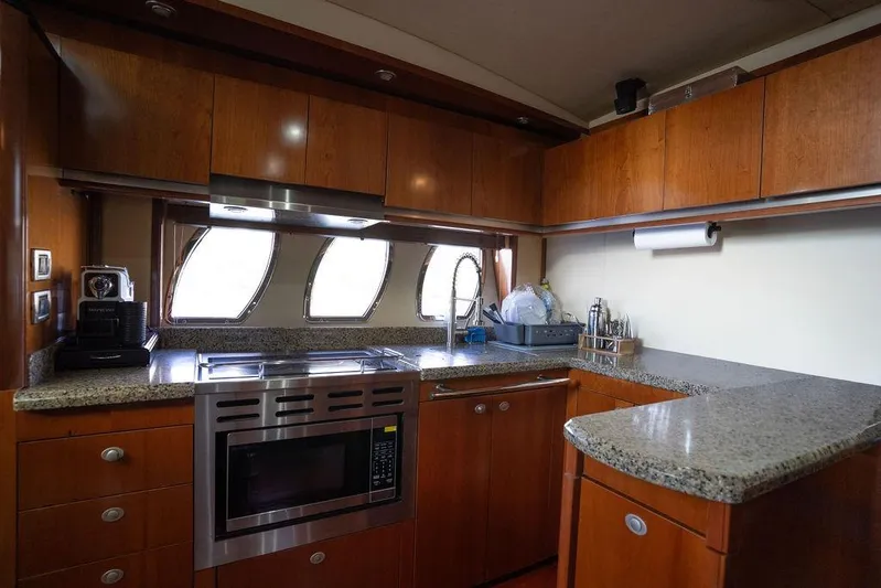  Yacht Photos Pics Luxurious kitchen interior of 2005 Sea Ray 48 Sundancer yacht with modern appliances.