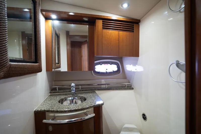  Yacht Photos Pics Luxurious bathroom interior of 2005 Sea Ray 48 Sundancer yacht with modern fixtures.
