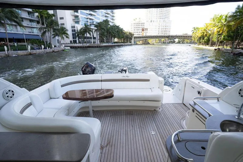  Yacht Photos Pics 2005 Sea Ray 48 Sundancer yacht with spacious deck and waterfront view.