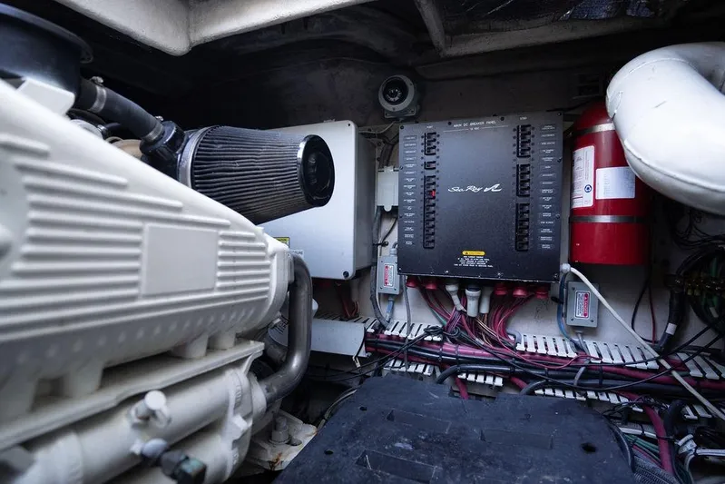  Yacht Photos Pics Engine room of 2005 Sea Ray 48 Sundancer with control panel and fire extinguisher.