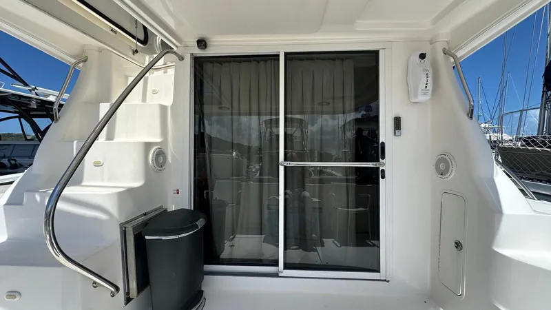 Get N Free Yacht Photos Pics 2006 Sea Ray 44 Sedan Bridge yacht with sliding glass door and staircase.