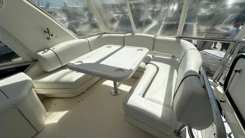 Get N Free Yacht Photos Pics 2006 Sea Ray 44 Sedan Bridge interior with white seating and table.