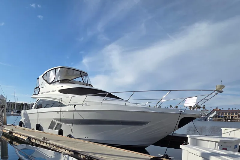 Sea Pa Yacht Photos Pics Luxury 2007 Marquis 55 LS yacht docked under clear blue sky.