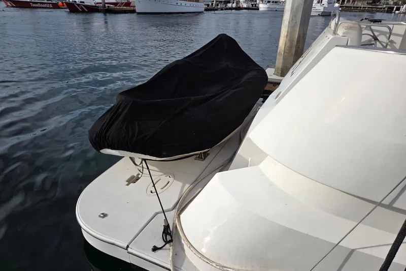 Sea Pa Yacht Photos Pics 2007 Marquis 55 LS yacht docked with covered equipment on deck.