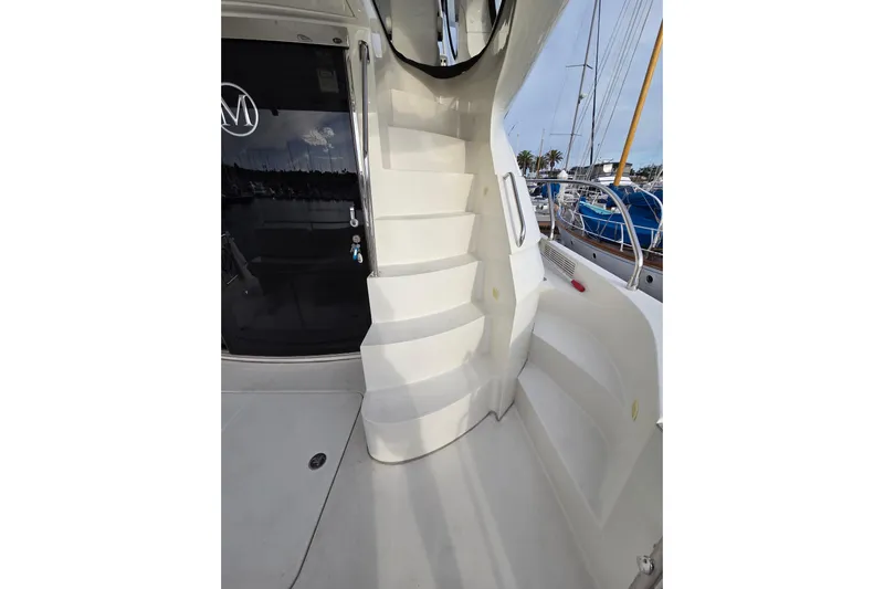 Sea Pa Yacht Photos Pics Staircase on 2007 Marquis 55 LS yacht with marina view.