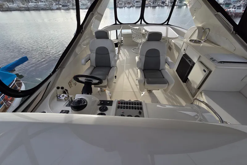 Sea Pa Yacht Photos Pics Luxurious 2007 Marquis 55 LS yacht interior with helm, seating, and kitchenette.