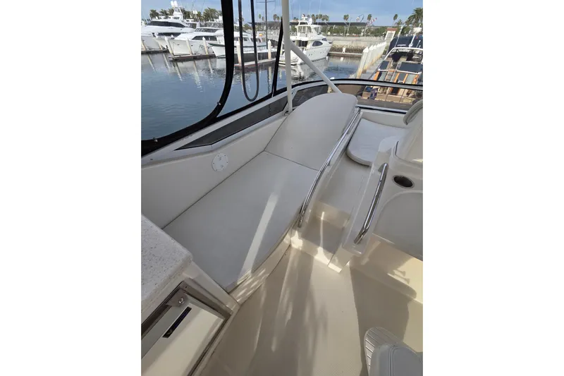 Sea Pa Yacht Photos Pics 2007 Marquis 55 LS yacht interior with sleek seating and marina view.