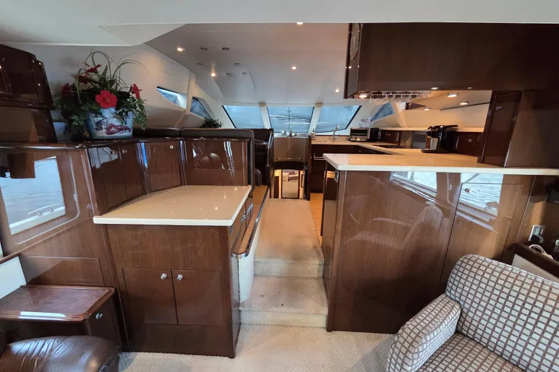 Sea Pa Yacht Photos Pics Luxurious interior of a 2007 Marquis 55 LS yacht with elegant wood finishes.