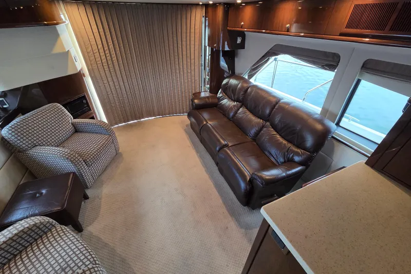 Sea Pa Yacht Photos Pics Luxurious 2007 Marquis 55 LS yacht interior with leather sofa and armchairs.
