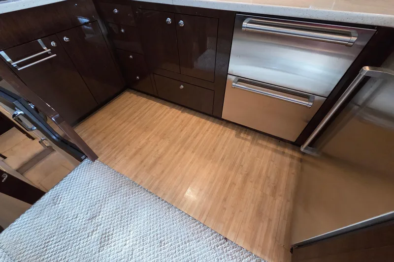 Sea Pa Yacht Photos Pics Luxurious kitchen interior of 2007 Marquis 55 LS yacht with modern cabinetry and appliances.