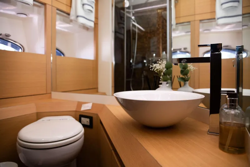 Dorothy Ann Yacht Photos Pics Luxurious bathroom interior on 2012 Pershing 82 yacht, featuring modern sink and elegant decor.