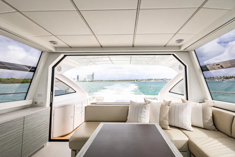 Sea Suite I Yacht Photos Pics Luxurious interior of 2021 Pershing 62 yacht with ocean view.