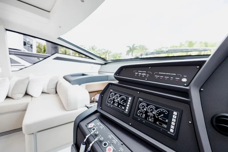 Sea Suite I Yacht Photos Pics Interior cockpit of 2021 Pershing 62 yacht with modern control panels.