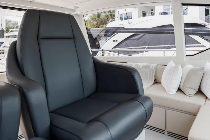 Sea Suite I Yacht Photos Pics Luxurious interior of 2021 Pershing 62 yacht with plush seating and elegant design.