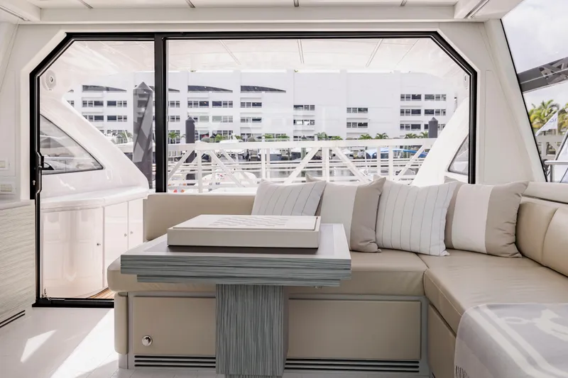 Sea Suite I Yacht Photos Pics Luxurious interior of 2021 Pershing 62 yacht with elegant seating and modern design.