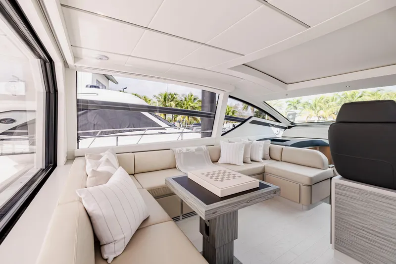 Sea Suite I Yacht Photos Pics Luxurious interior of 2021 Pershing 62 yacht with elegant seating and modern design.
