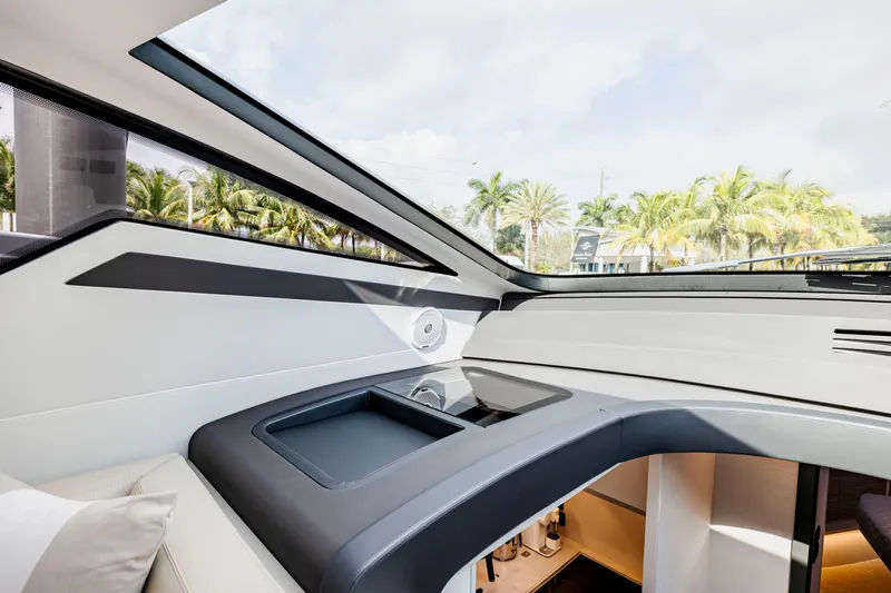 Sea Suite I Yacht Photos Pics Interior view of 2021 Pershing 62 yacht with modern design and large windows.
