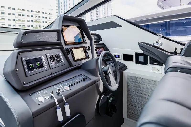 Sea Suite I Yacht Photos Pics Cockpit of 2021 Pershing 62 yacht with advanced navigation systems and modern controls.