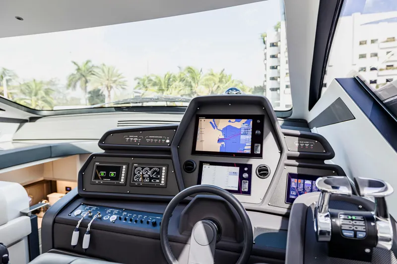 Sea Suite I Yacht Photos Pics 2021 Pershing 62 yacht cockpit with advanced navigation system and modern controls.