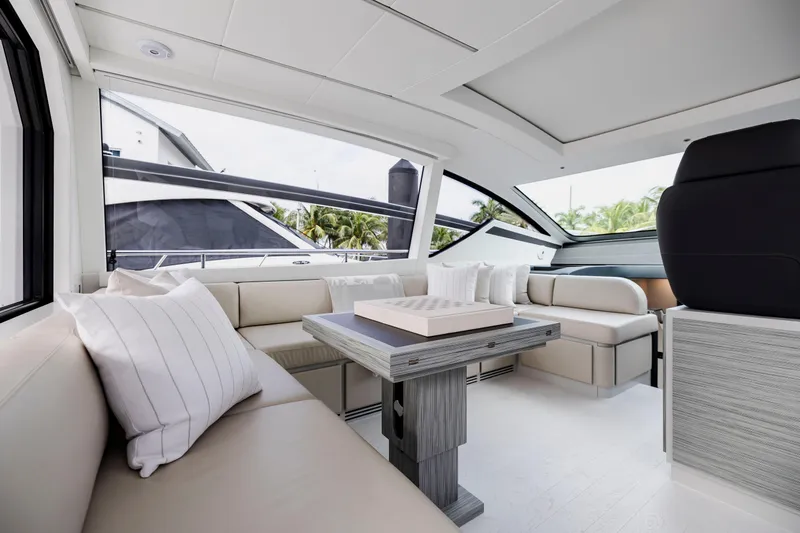 Sea Suite I Yacht Photos Pics Luxurious interior of 2021 Pershing 62 yacht with elegant seating and modern design.