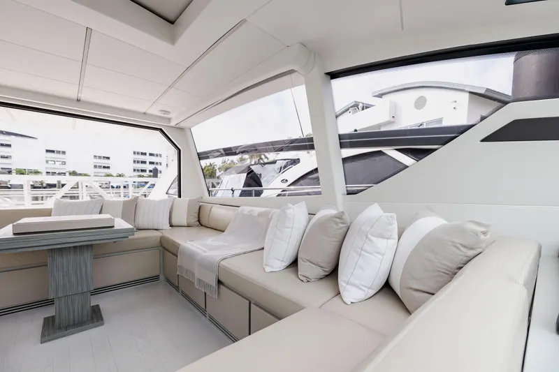 Sea Suite I Yacht Photos Pics Luxurious interior of 2021 Pershing 62 yacht with elegant seating and modern design.