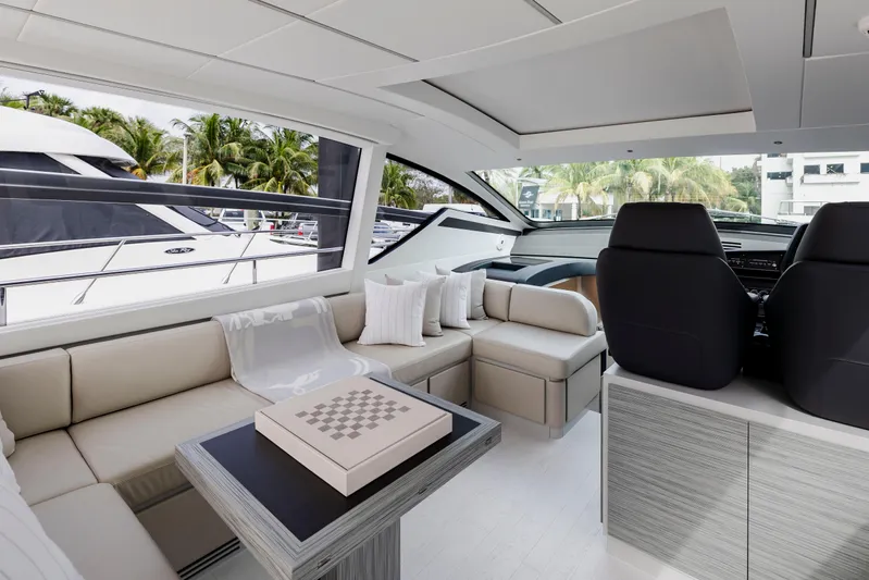 Sea Suite I Yacht Photos Pics Luxurious interior of 2021 Pershing 62 yacht with elegant seating and modern design.