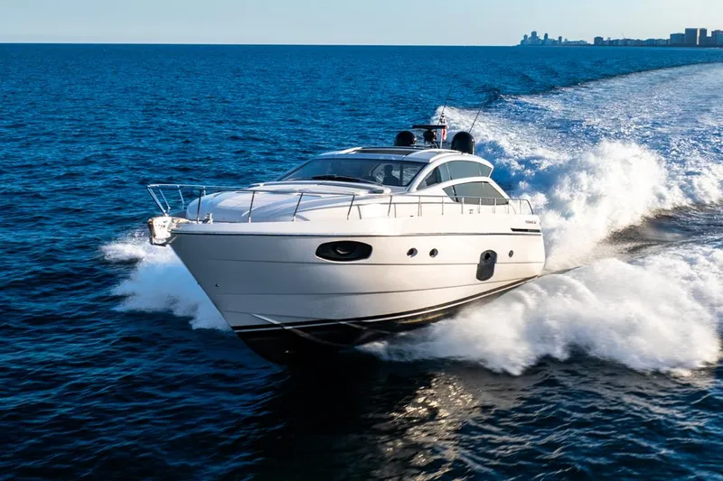 Sea Suite I Yacht Photos Pics 2021 Pershing 62 yacht cruising swiftly on open blue sea.