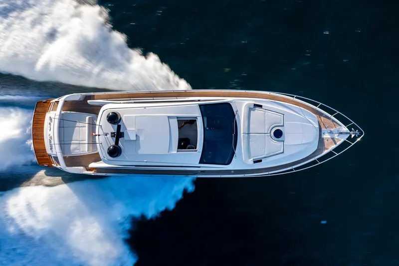 Sea Suite I Yacht Photos Pics Aerial view of 2021 Pershing 62 yacht cruising on water.