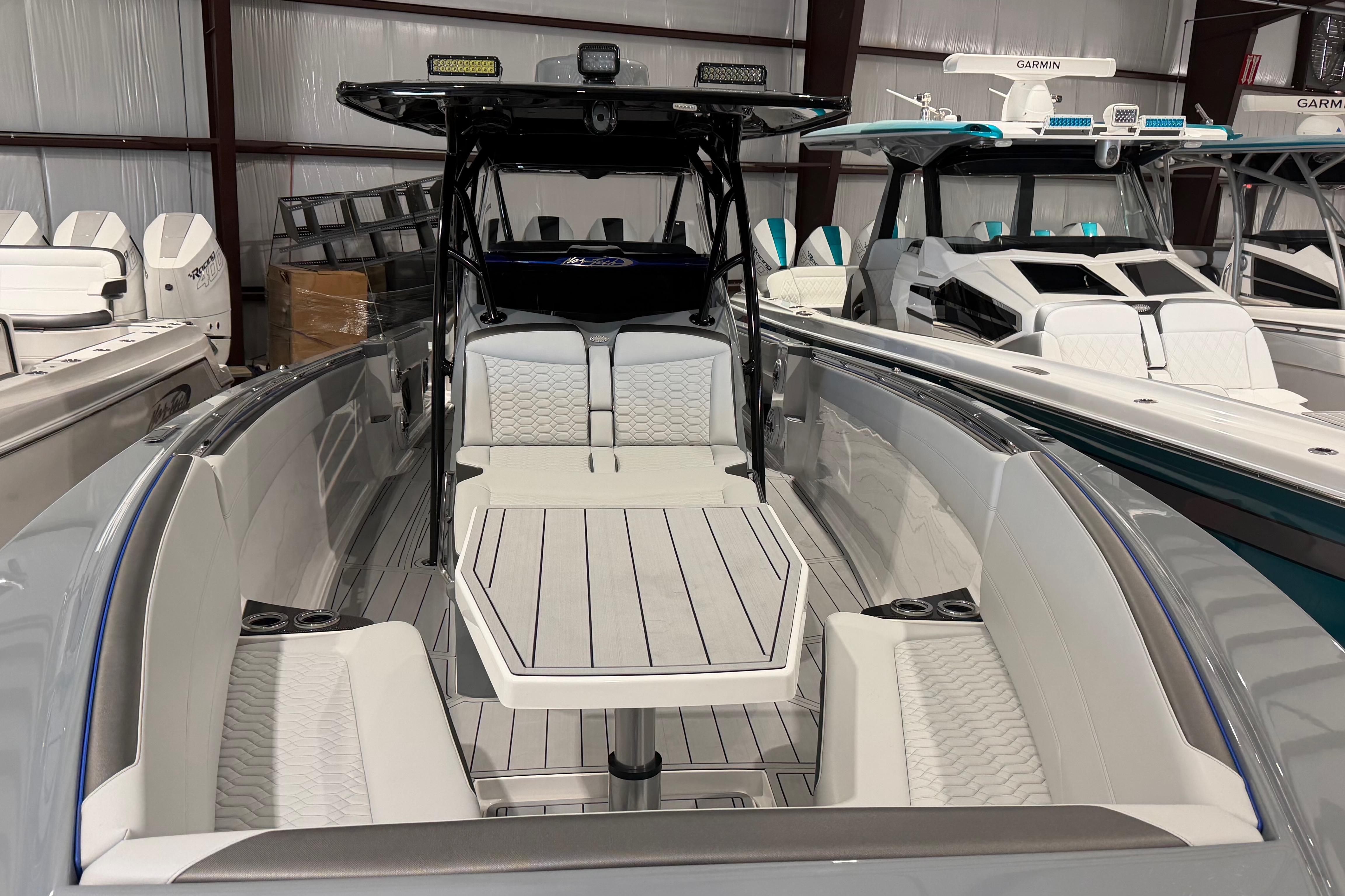 2025 Nor-Tech 390 Sport Center Console boat with sleek seating and modern design.