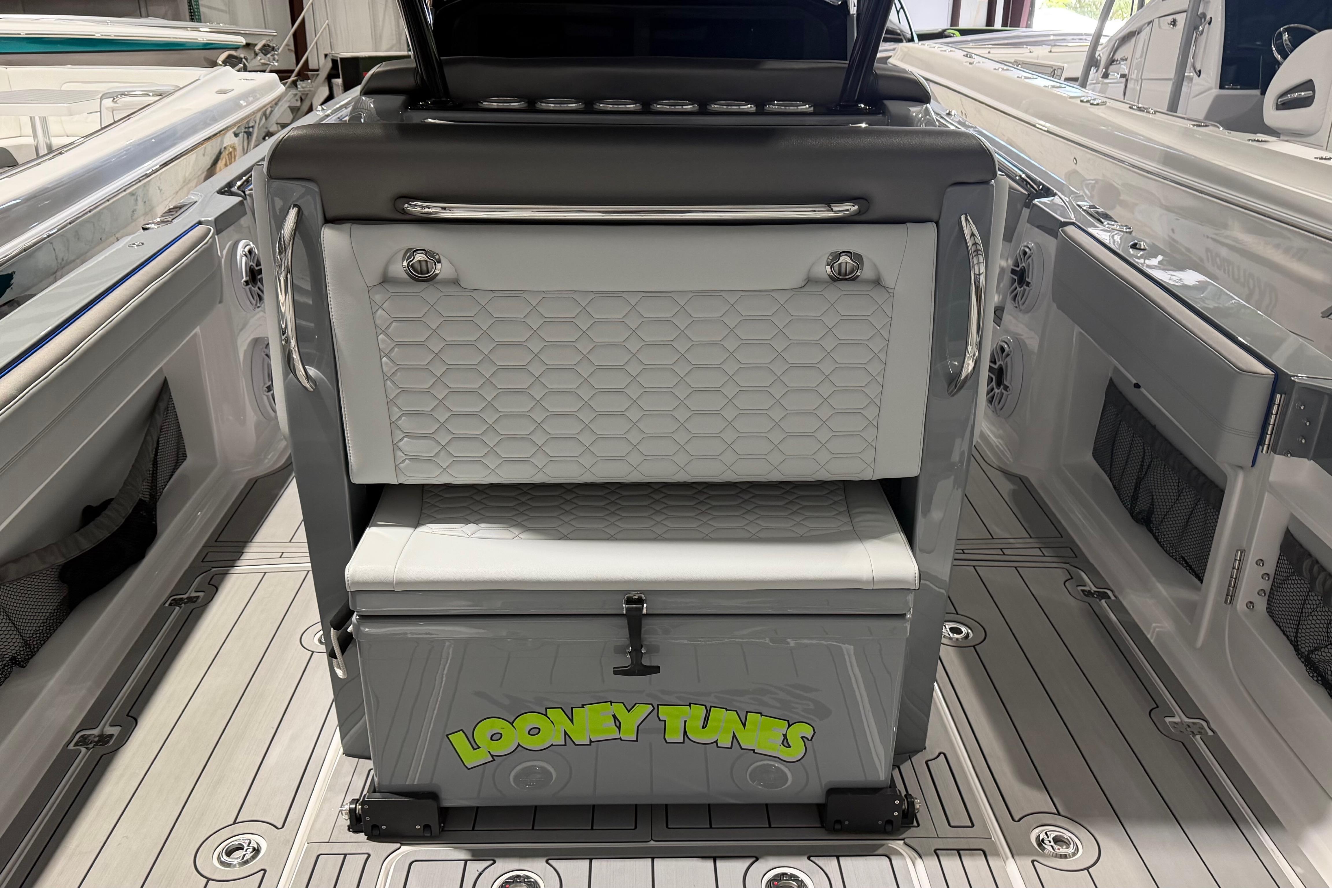 2025 Nor-Tech 390 Sport Center Console interior with Looney Tunes design on seating.