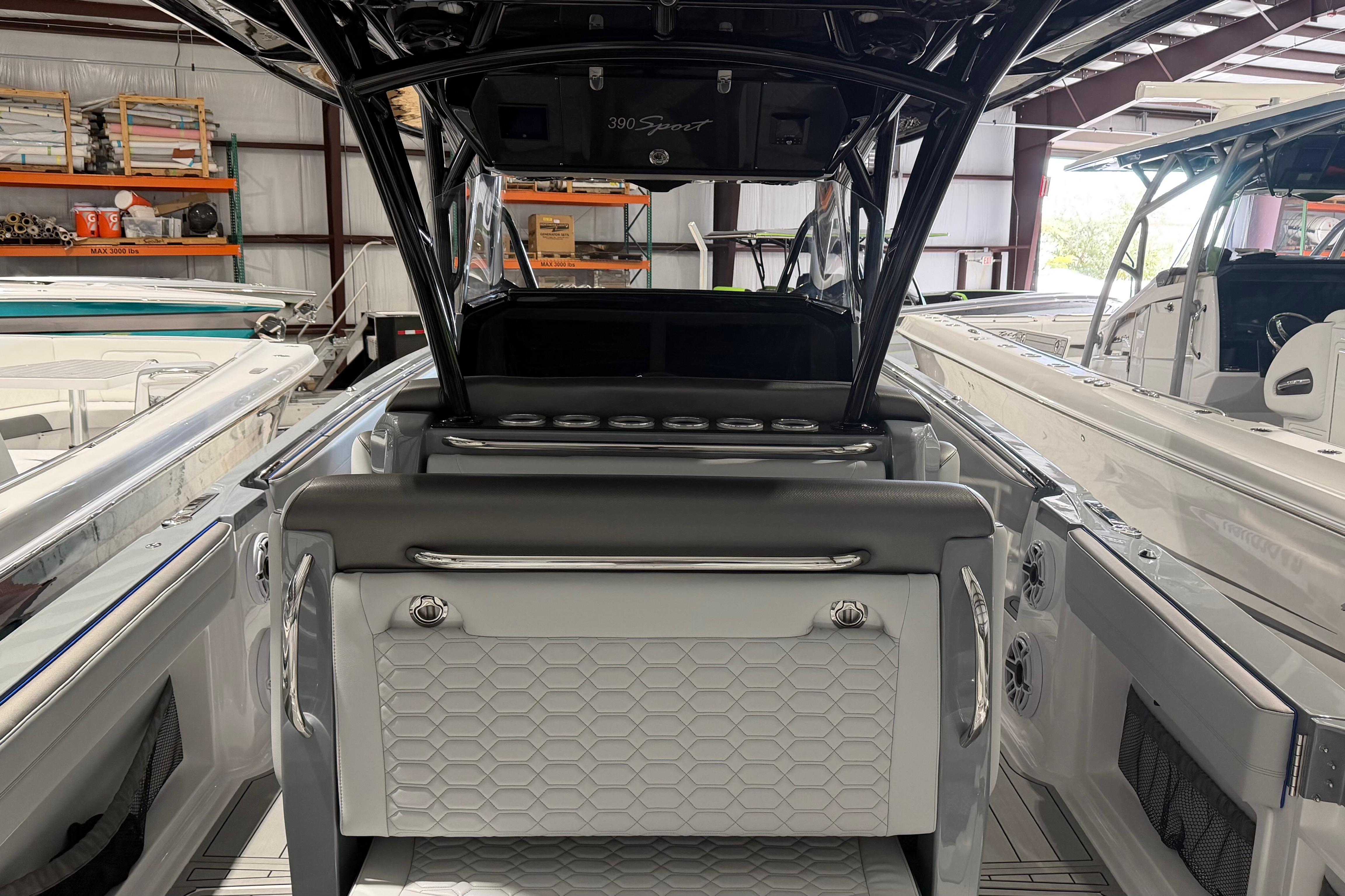 2025 Nor-Tech 390 Sport Center Console boat interior in a showroom setting.