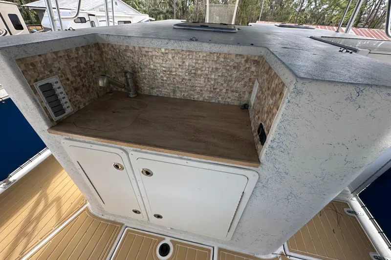  Yacht Photos Pics 1999 Catamaran Coaches 31 boat interior with kitchenette and storage cabinets.