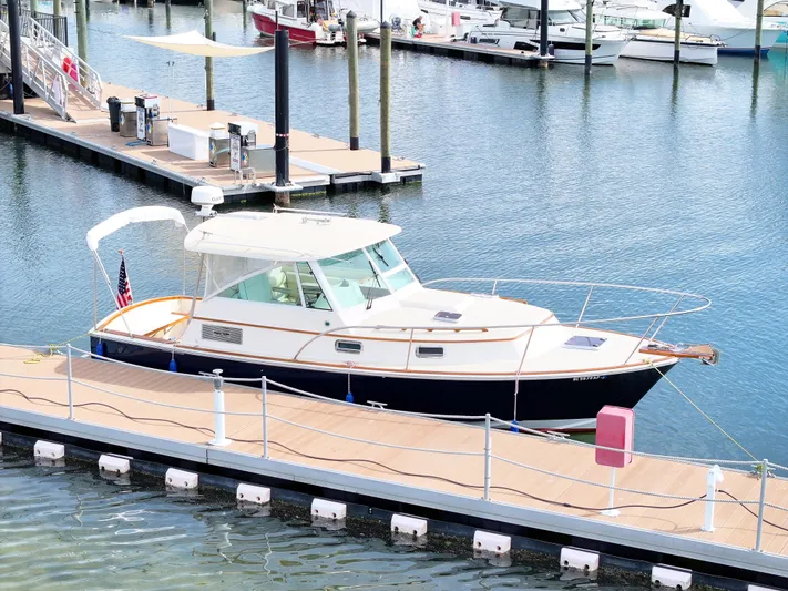 C'est La Vie Yacht Photos Pics 2010 Bruckmann Bluestar 29.9 docked at marina, featuring sleek design and classic styling.