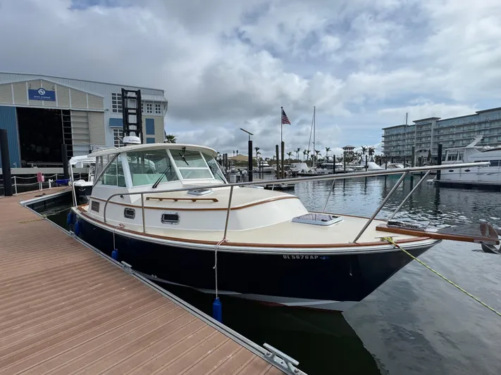 C'est La Vie Yacht Photos Pics 2010 Bruckmann Bluestar 29.9 boat docked at marina under cloudy sky.