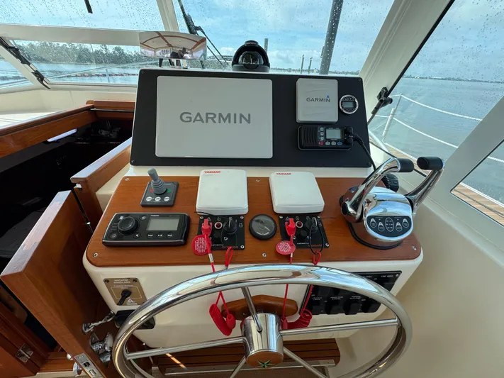 C'est La Vie Yacht Photos Pics Helm of 2010 Bruckmann Bluestar 29.9 with Garmin navigation system and controls.