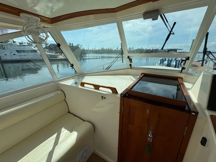 C'est La Vie Yacht Photos Pics Interior view of 2010 Bruckmann Bluestar 29.9 boat with seating and helm.